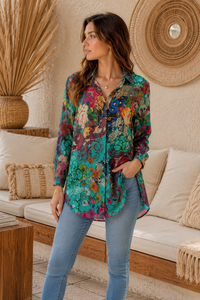 Stef Silk Shirt side view showing curved high-low hem and roll-tab sleeves in semi-sheer silk-viscose paisley fabric - Cienna Designs