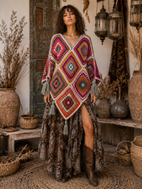 Sunset Mosaic Crochet Poncho with handcrafted granny squares in warm sunset tones of orange, red and burgundy with teal and cream accents and tassel detailing - Cienna Designs