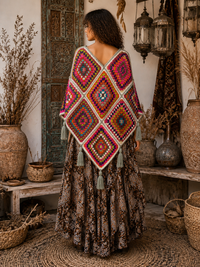 Sunset Mosaic Crochet Poncho back view showing handcrafted granny square crochet in warm oranges, reds and burgundy with soft grey border - Cienna Designs