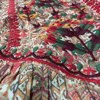 Close-up of Vintage Fold midi dress showing richly printed folk floral pattern and intricate hand embroidery on rayon - Sample D-1365 by Cienna Designs